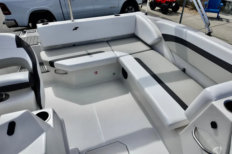 Slide: The Image of 2026 Starcraft SVX 171 OB boat interior with white and gray seating arrangement. - 9