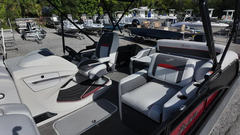 Slide: The Image of 2022 Barletta Corsa 23U pontoon boat interior with modern seating and helm. - 12
