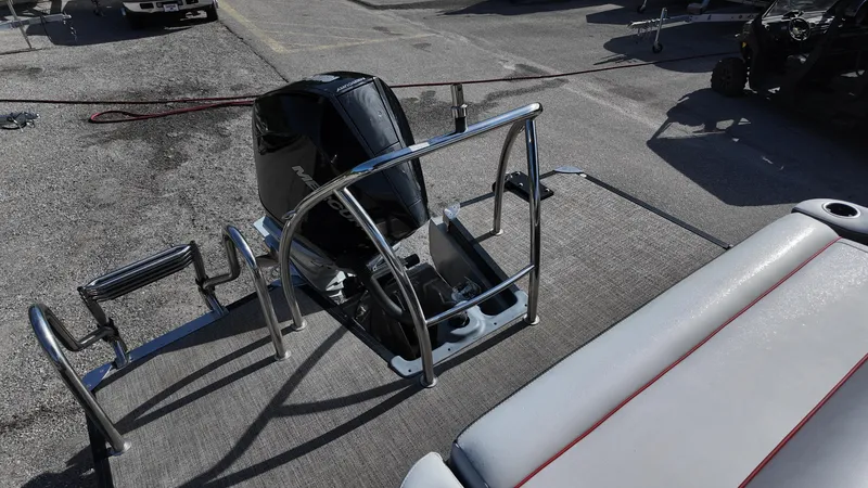 Slide: The Image of 2022 Barletta Corsa 23U boat with Mercury outboard motor and rear seating area. - 17