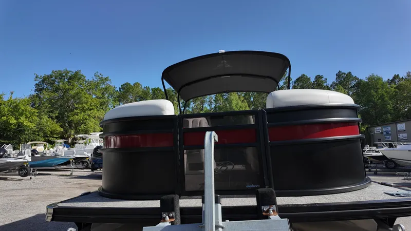 Slide: The Image of 2022 Barletta Corsa 23U pontoon boat in a sunny outdoor setting. - 8