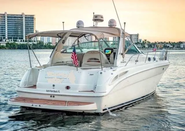 The Image of 2002 Sea Ray 380 Sundancer yacht on water at sunset. - 0