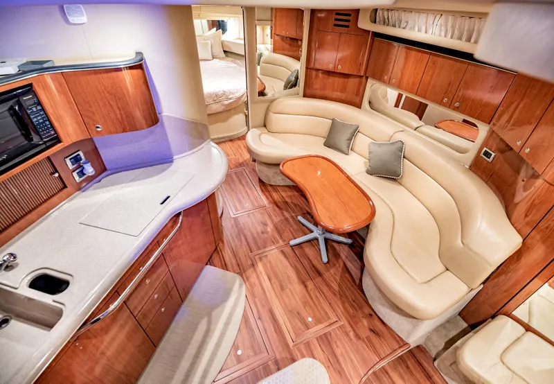 Slide: The Image of Luxurious 2002 Sea Ray 380 Sundancer interior with elegant seating and modern amenities. - 11