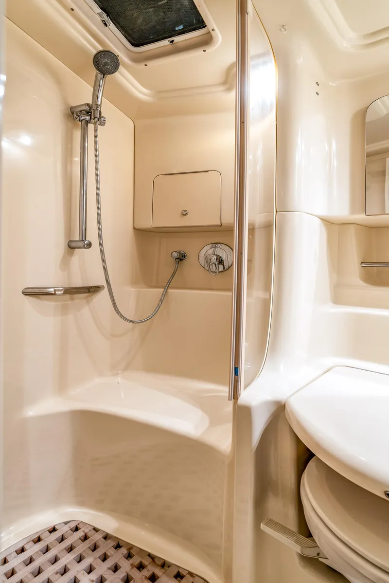 Slide: The Image of Luxurious bathroom in 2002 Sea Ray 380 Sundancer yacht with shower and modern amenities. - 13