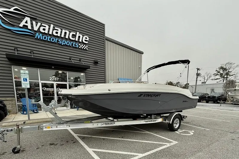 The Image of 2026 Starcraft SVX 191 OB boat on trailer at Avalanche Motorsports dealership. - 0