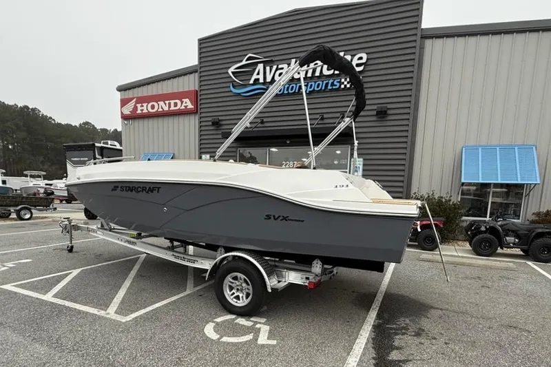 Slide: The Image of 2026 Starcraft SVX 191 OB boat on trailer outside dealership. - 2