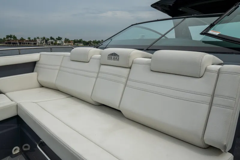 Slide: The Image of Luxurious seating on 2022 Cruisers Yachts 38 GLS, featuring plush white upholstery. - 11