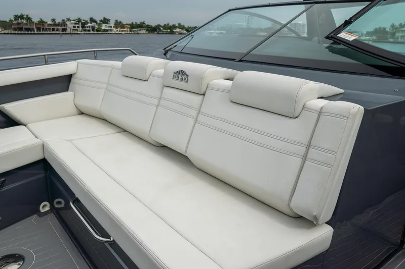 Slide: The Image of 2022 Cruisers Yachts 38 GLS boat with luxurious white seating on deck. - 14