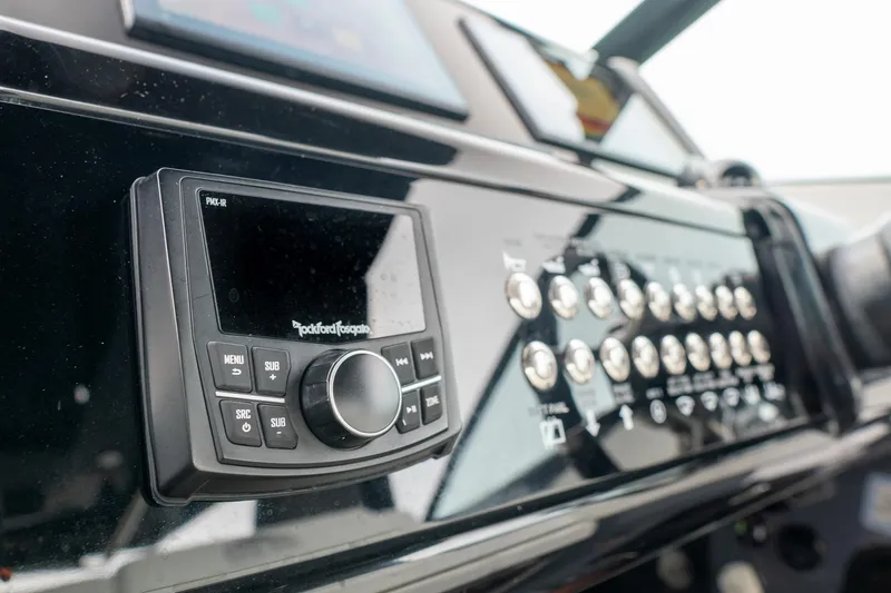 Slide: The Image of Control panel of 2022 Cruisers Yachts 38 GLS with Rockford Fosgate audio system. - 21