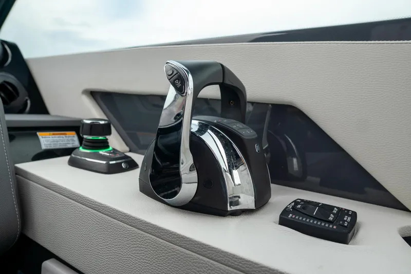 Slide: The Image of 2022 Cruisers Yachts 38 GLS throttle controls and dashboard details. - 24