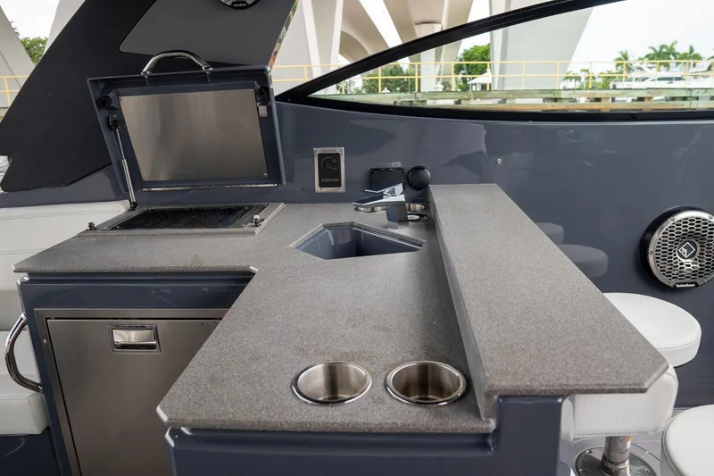 Slide: The Image of 2022 Cruisers Yachts 38 GLS interior with sleek kitchenette and modern amenities. - 33