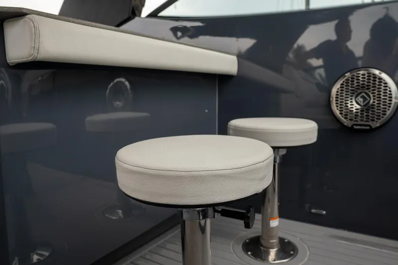 Slide: The Image of 2022 Cruisers Yachts 38 GLS interior with bar stools and speaker. - 36