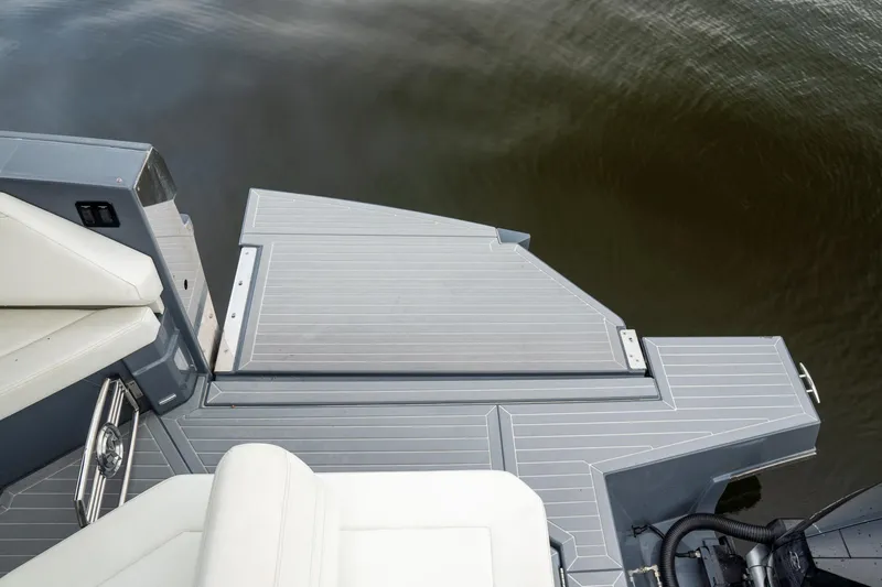 Slide: The Image of 2022 Cruisers Yachts 38 GLS swim platform with sleek design on calm water. - 43