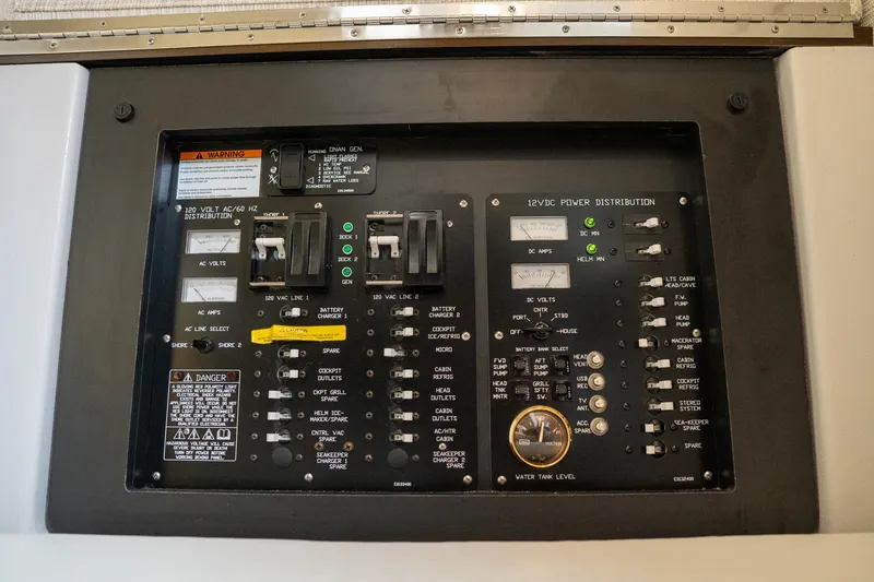 Slide: The Image of Electrical control panel of 2022 Cruisers Yachts 38 GLS, featuring switches and indicators. - 46