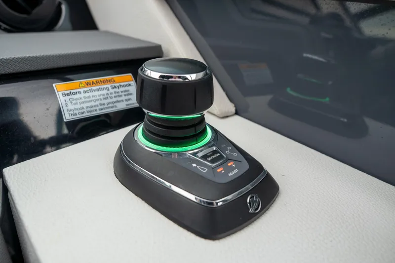 Slide: The Image of Joystick control on 2022 Cruisers Yachts 38 GLS dashboard. - 25