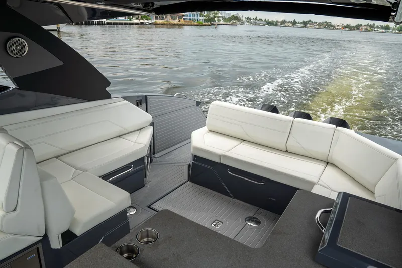 Slide: The Image of 2022 Cruisers Yachts 38 GLS interior with white seating, overlooking water. - 30