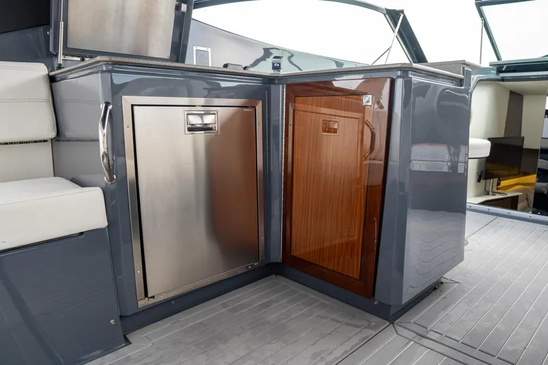 Slide: The Image of 2022 Cruisers Yachts 38 GLS interior with stainless steel and wood cabinetry. - 34