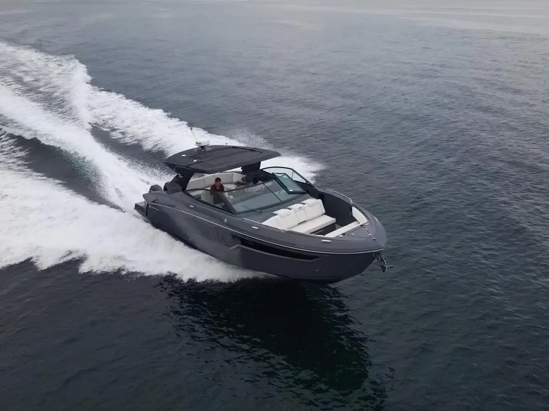 Slide: The Image of 2022 Cruisers Yachts 38 GLS speeding on open water. - 4