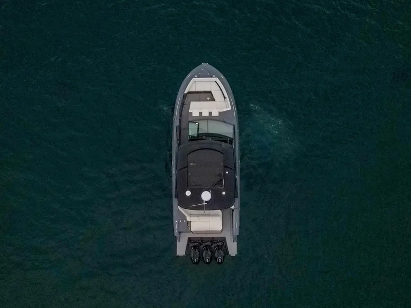 Slide: The Image of 2022 Cruisers Yachts 38 GLS, aerial view, sleek design on open water. - 7