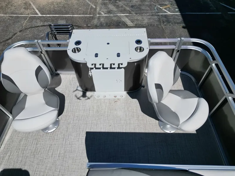 Slide: The Image of 2024 Tahoe 21LTZ RF boat with gray and black seating area. - 15