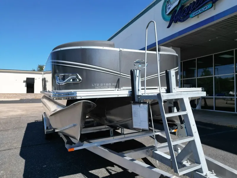 Slide: The Image of 2024 Tahoe 21LTZ RF pontoon boat on trailer, gray color. - 6