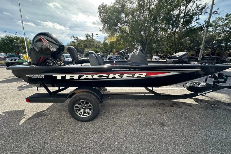 The Image of 2026 Tracker Pro Team 195 boat on trailer in parking lot. - 0