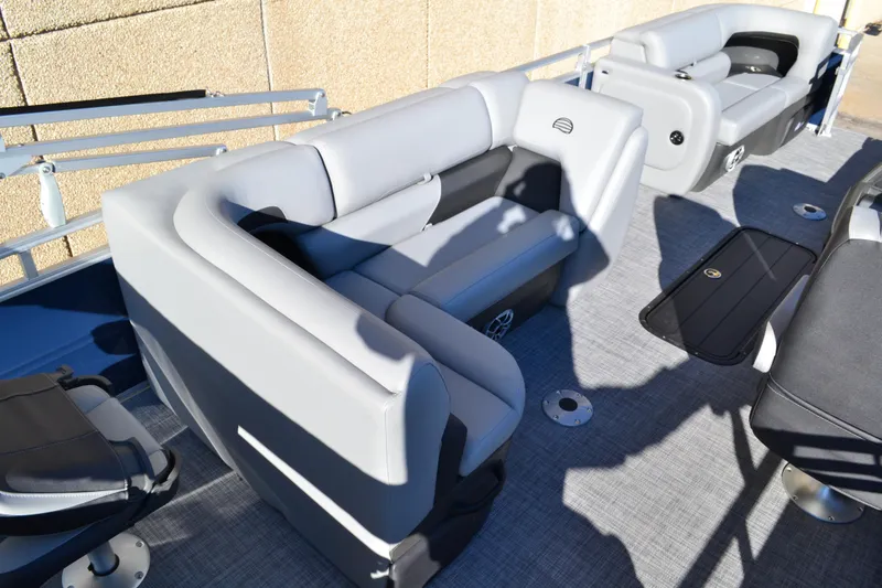 Slide: The Image of 2026 Sun Tracker SportFish 22 XP3 pontoon boat interior with gray seating and flooring. - 16