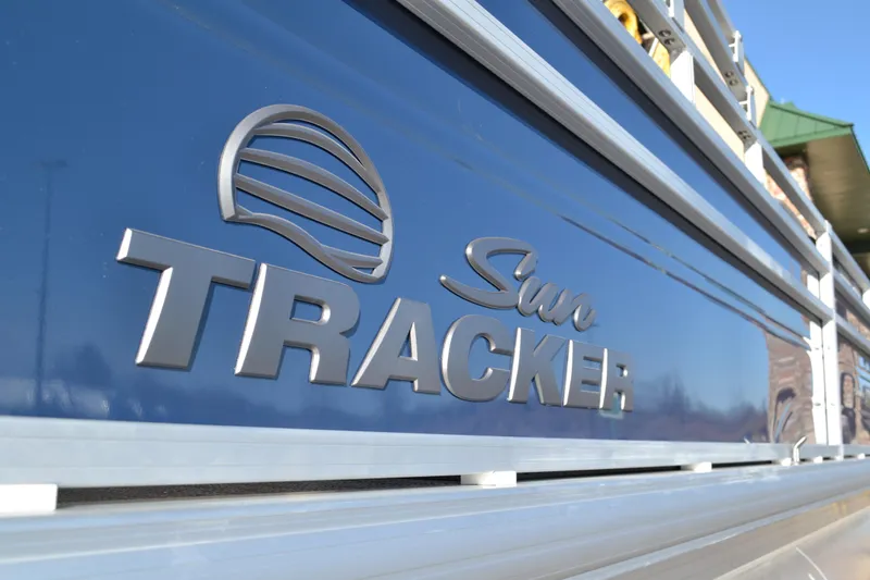 Slide: The Image of 2026 Sun Tracker SportFish 22 XP3 logo on blue boat exterior. - 3