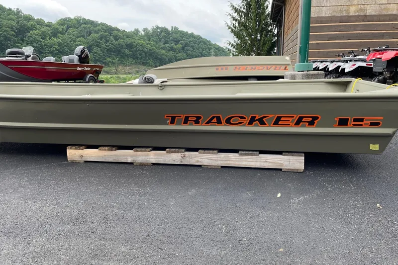 The Image of 2026 Tracker Grizzly 15 Jon boat on display, parked on wooden pallets. - 0