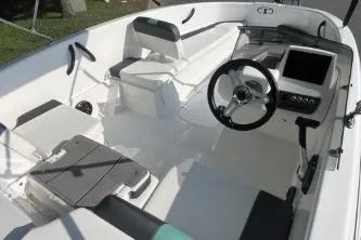 Slide: The Image of 2026 Tahoe T16 boat interior with modern steering, seating, and control panel. - 5