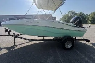 Slide: The Image of 2026 Tahoe T16 boat on trailer in sunny outdoor setting. - 2