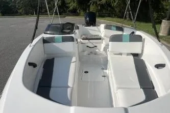 Slide: The Image of 2026 Tahoe T16 boat interior with seating, white and gray upholstery, and open deck design. - 4