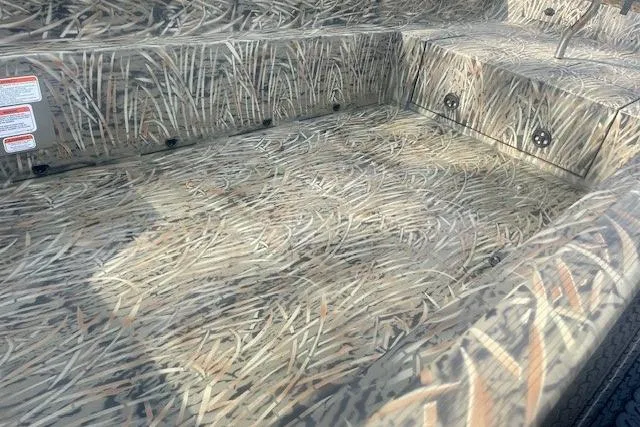 Slide: The Image of 2026 Tracker Grizzly 1650 T Prairie Wings Edition with camouflage interior design. - 5