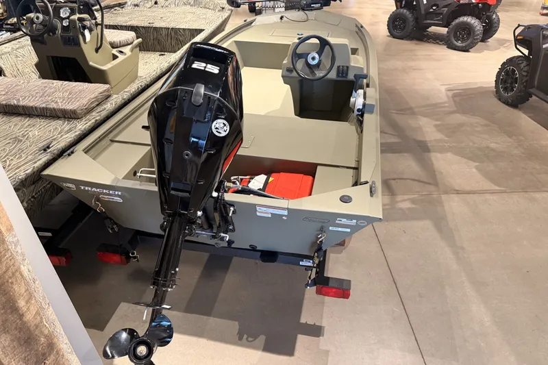 Slide: The Image of 2026 Tracker Grizzly 1648 SC boat with 25 HP motor in showroom. - 15