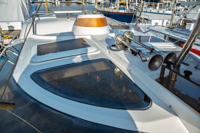 Slide: The Image of 2022 Ranger Tugs R-29 S boat deck with windows and horns in marina. - 10