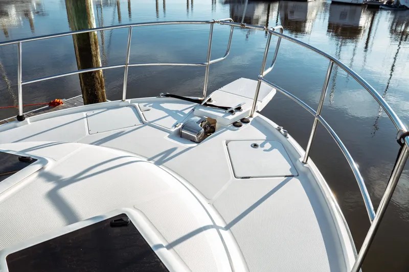 Slide: The Image of Bow of 2022 Ranger Tugs R-29 S boat with stainless steel railings. - 9