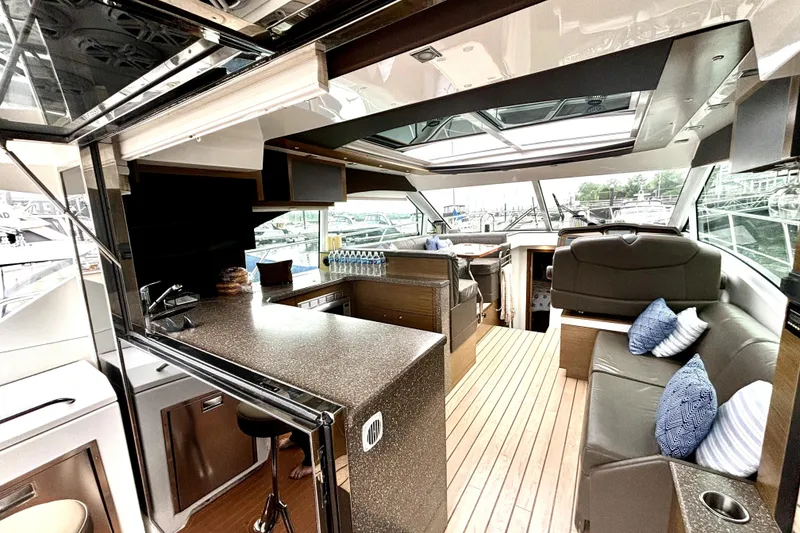 Slide: The Image of 2014 Cruisers Yachts 45 Cantius interior with modern design and spacious seating area. - 11