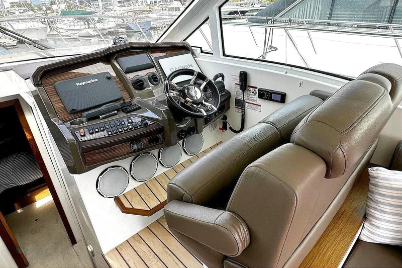 Slide: The Image of 2014 Cruisers Yachts 45 Cantius helm with leather seats and modern controls. - 13