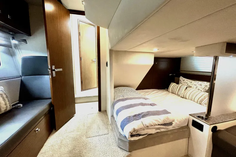 Slide: The Image of Luxurious 2014 Cruisers Yachts 45 Cantius cabin interior with cozy bed and modern design. - 17
