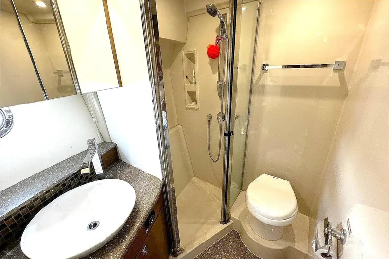 Slide: The Image of Luxurious bathroom in 2014 Cruisers Yachts 45 Cantius with modern fixtures and glass shower. - 18