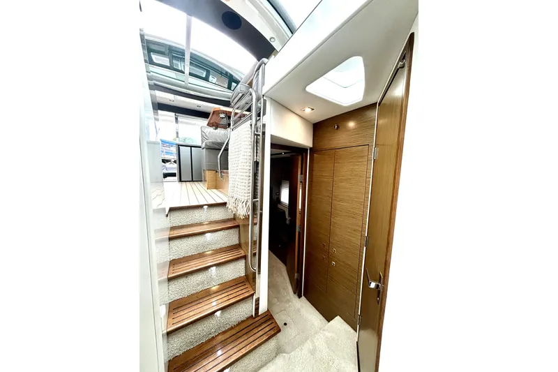 Slide: The Image of Interior of 2014 Cruisers Yachts 45 Cantius with wooden stairs and modern design. - 20