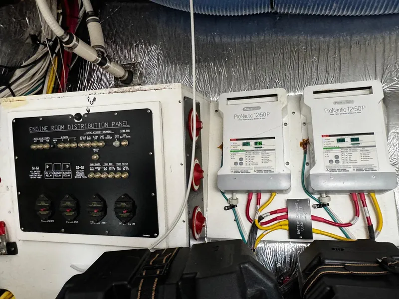 Slide: The Image of Engine room distribution panel and electrical components on a 2014 Cruisers Yachts 45 Cantius. - 25