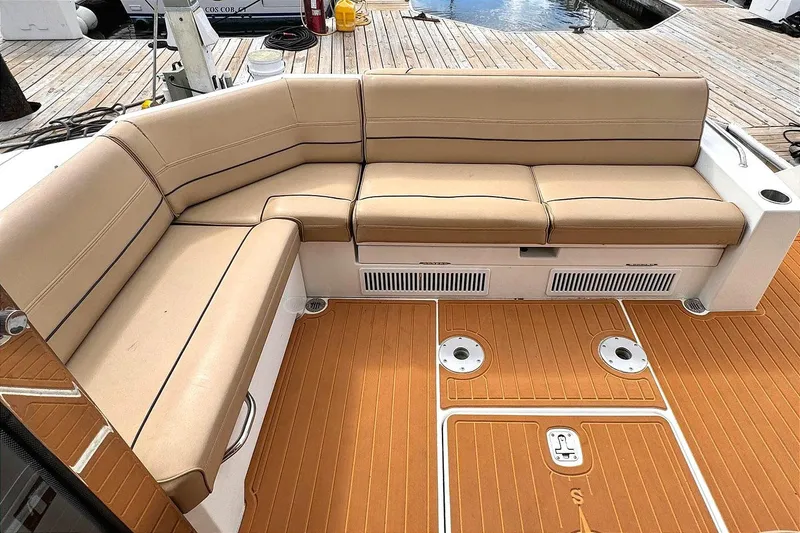 Slide: The Image of 2014 Cruisers Yachts 45 Cantius, beige seating, teak deck, docked at marina. - 4