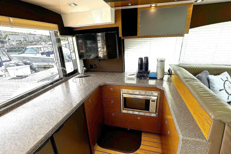 Slide: The Image of Luxurious 2014 Cruisers Yachts 45 Cantius interior with modern kitchen and sleek design. - 6