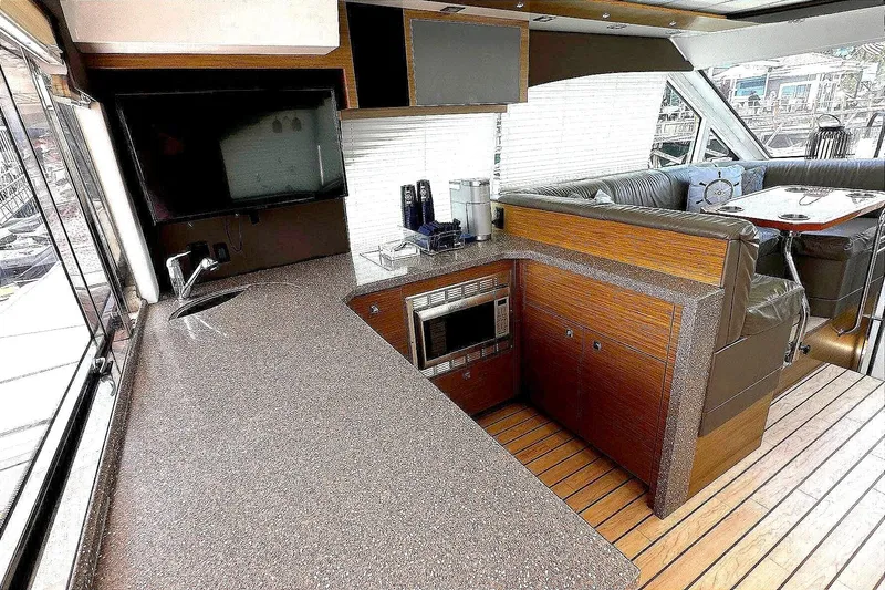 Slide: The Image of Interior of 2014 Cruisers Yachts 45 Cantius with modern kitchen and seating area. - 7