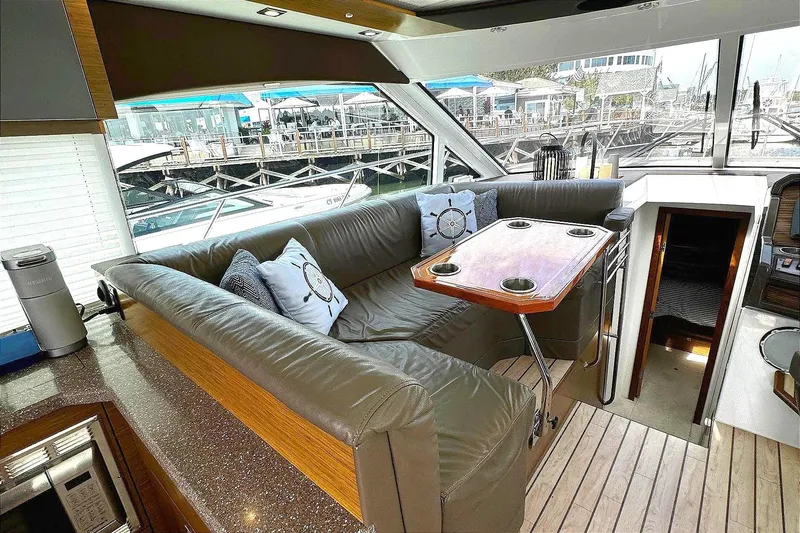 Slide: The Image of Luxurious 2014 Cruisers Yachts 45 Cantius interior with plush seating and elegant table. - 9
