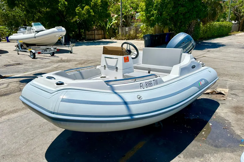 Slide: The Image of 2025 AB Inflatables Nautilus 11 DLX boat in a sunny outdoor setting. - 4