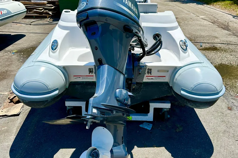 Slide: The Image of 2025 AB Inflatables Nautilus 11 DLX with Yamaha outboard motor, rear view. - 5