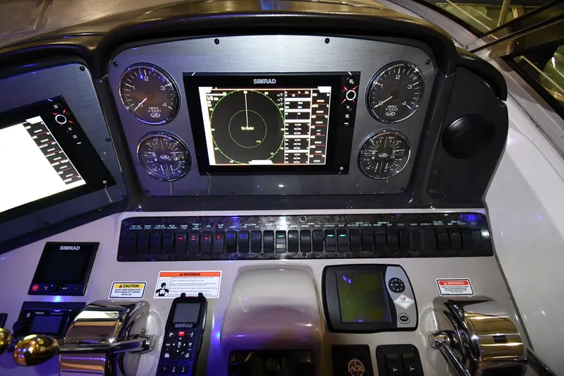 Slide: The Image of Control panel of a 2006 Sea Ray 40 Sundancer boat with navigation instruments. - 11