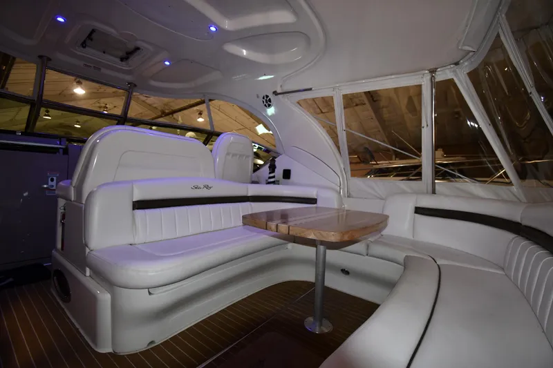 Slide: The Image of Luxurious interior of 2006 Sea Ray 40 Sundancer yacht with elegant seating and table. - 13