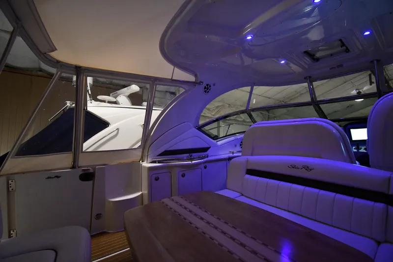 Slide: The Image of Interior of 2006 Sea Ray 40 Sundancer yacht with ambient blue lighting. - 14